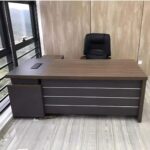A modern 1.8-meter professional office desk crafted from high-quality wood and metal, featuring ample storage, an ergonomic design, and a cable management system.