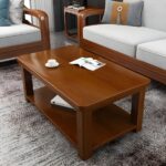 Business office coffee table with a sleek design, premium material, and lower shelf for storage, placed in a modern office setting.