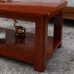 Business office coffee table with a sleek design, premium material, and lower shelf for storage, placed in a modern office setting.