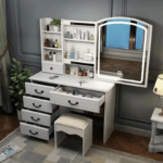 White vanity dressing table with large mirror and storage drawers for makeup and accessories.