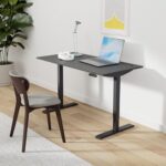 An electric standing desk with a sleek design, featuring height-adjustable functionality, ideal for a modern workspace.