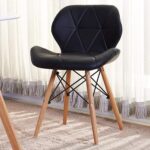 Eames Padded Dining Chair with wooden legs in a modern dining room setting.