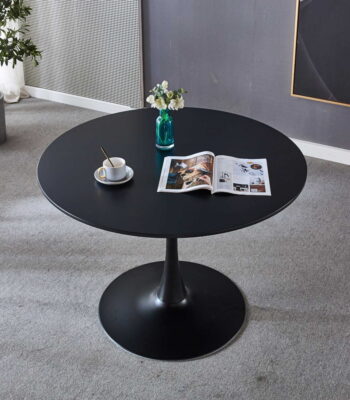 Vintage dining table made from high-quality wood with tapered legs and a smooth, polished finish, placed in a modern dining room.