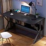 Computer desk with built-in shelf, spacious work surface, and additional storage for office essentials.