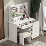 White vanity dressing table with large mirror and storage drawers for makeup and accessories.