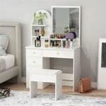 White vanity dressing table with large mirror and storage drawers for makeup and accessories.