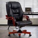 A professional Office Director seated at their executive desk, reviewing documents and leading the team toward achieving company goals.