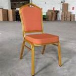 Banquet conference seats arranged in a formal setting, featuring padded cushions and sleek designs.