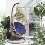 Hammock outdoor swing hanging in a garden, offering a comfortable and relaxing spot for lounging.