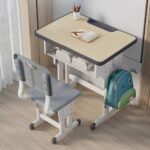Kid's desk and chair set designed for children with adjustable features and storage compartments.