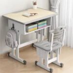 Kid's desk and chair set designed for children with adjustable features and storage compartments.