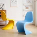 Vitra Panton Eames Chair in vibrant color with a smooth, sculptural design, showcasing its iconic modern style.