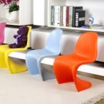 Vitra Panton Eames Chair in vibrant color with a smooth, sculptural design, showcasing its iconic modern style.