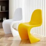 Vitra Panton Eames Chair in vibrant color with a smooth, sculptural design, showcasing its iconic modern style.