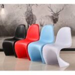Vitra Panton Eames Chair in vibrant color with a smooth, sculptural design, showcasing its iconic modern style.