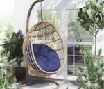 Hammock outdoor swing hanging in a garden, offering a comfortable and relaxing spot for lounging.