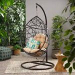 Hammock outdoor swing hanging in a garden, offering a comfortable and relaxing spot for lounging.