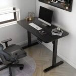 Motorized adjustable standing desk with a sleek design and motorized lifting mechanism for easy height adjustments.