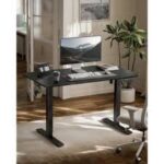 Motorized adjustable standing desk with a sleek design and motorized lifting mechanism for easy height adjustments.