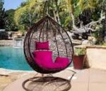 Hammock outdoor swing hanging in a garden, offering a comfortable and relaxing spot for lounging.