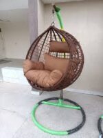 Hammock outdoor swing hanging in a garden, offering a comfortable and relaxing spot for lounging.