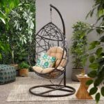 Hammock outdoor swing hanging in a garden, offering a comfortable and relaxing spot for lounging.
