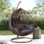 Hammock outdoor swing hanging in a garden, offering a comfortable and relaxing spot for lounging.
