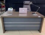 1.8-meter office desk with a spacious work surface, storage drawers, and a sleek, modern design.