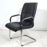 Comfortable and stylish executive visitor seat in a professional office setting.