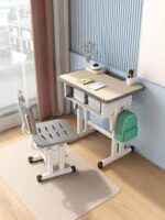 Kid's desk and chair set designed for children with adjustable features and storage compartments.