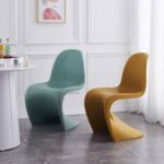 Vitra Panton Eames Chair in vibrant color with a smooth, sculptural design, showcasing its iconic modern style.