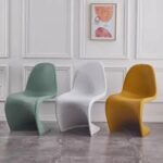 Vitra Panton Eames Chair in vibrant color with a smooth, sculptural design, showcasing its iconic modern style.