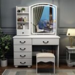 White vanity dressing table with large mirror and storage drawers for makeup and accessories.
