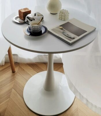 A modern round office dining table, designed for professional settings, offering a sleek and functional space for dining or meetings.