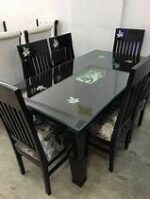 Elegant 6-seater dining table with a spacious design, crafted from high-quality materials for durability and style, perfect for family meals and gatherings.