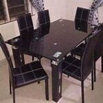 Elegant 6-seater dining table with a spacious design, crafted from high-quality materials for durability and style, perfect for family meals and gatherings.