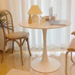 A modern round office dining table, designed for professional settings, offering a sleek and functional space for dining or meetings.