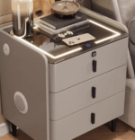 3 Drawers Smart Bedside Table Cabinet – Modern Bedroom Storage Solution The 3 Drawers Smart Bedside Table Cabinet is a stylish and practical furniture piece designed to enhance bedroom organization and convenience. It is ideal for storing personal items such as books, phones, chargers, medicines, and bedtime essentials. Because of its compact design, it fits perfectly beside beds in both small and large bedroom spaces. Moreover, this bedside cabinet combines modern aesthetics with smart storage functionality. As a result, it helps keep your bedroom neat, organized, and clutter-free while adding a touch of elegance to the interior. Spacious 3-Drawer Storage Design This bedside table features three well-structured drawers that provide ample storage space for everyday essentials. In addition, the drawers allow users to separate items for better organization and quick access. Furthermore, the smooth sliding mechanism ensures easy opening and closing without noise or effort. Therefore, it is highly convenient for nighttime use and daily bedroom routines. Smart and Functional Bedroom Design The smart design of this bedside cabinet focuses on maximizing storage while maintaining a compact footprint. Because of its space-saving structure, it is suitable for apartments, guest rooms, and master bedrooms. In addition, the top surface provides enough space for a bedside lamp, alarm clock, decorative items, or charging devices. Consequently, it enhances both functionality and bedroom aesthetics. Durable and Long-Lasting Construction This bedside table is built using high-quality engineered wood or MDF material designed for durability. Moreover, the strong structure ensures stability and long-term performance in everyday use. In addition, the surface is often scratch-resistant and easy to clean. Therefore, it maintains a fresh and polished look over time even with regular use. Modern and Elegant Bedroom Appearance The 3 Drawers Smart Bedside Table Cabinet features a clean and modern design that complements different bedroom styles. Because of its simple yet elegant finish, it blends easily with beds, wardrobes, and other bedroom furniture. Furthermore, it enhances the overall visual appeal of the room while maintaining practicality. As a result, it is both a decorative and functional addition to any bedroom. Key Features 3 spacious drawers for organized storage Compact and space-saving bedside design Smooth sliding drawer mechanism Durable engineered wood/MDF construction Scratch-resistant and easy-to-clean surface Modern and stylish bedroom appearance Stable structure for daily use Top surface for lamps and accessories Suitable for bedrooms, guest rooms, and apartments Perfect for Organized and Stylish Bedrooms The 3 Drawers Smart Bedside Table Cabinet is an excellent choice for anyone looking to improve bedroom organization while maintaining a modern look. It provides practical storage and enhances convenience for everyday living.