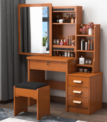 Modern Dressing Vanity Table – SEO Optimized Website Product Description Modern Dressing Vanity Table Enhance your bedroom with the Modern Dressing Vanity Table, a stylish and functional furniture piece designed to make your daily beauty routine more comfortable and organized. Whether you are getting ready for work, school, or a special occasion, this elegant vanity table provides a dedicated space for applying makeup, styling your hair, and storing your beauty essentials. Moreover, its contemporary design adds a touch of sophistication to bedrooms, apartments, hotels, and dressing rooms. Key Features Modern and elegant vanity table design Premium engineered wood construction Large mirror for convenient grooming and makeup application Spacious tabletop for cosmetics and beauty accessories Multiple storage drawers for organized storage Scratch-resistant laminated finish Strong and stable construction for long-lasting durability Smooth-gliding drawers with quality hardware Easy-to-clean and low-maintenance surface Compact design suitable for bedrooms and apartments Comfortable legroom for convenient seating Ideal for homes, apartments, hotels, and dressing rooms