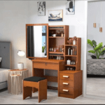 Modern Dressing Vanity Table – SEO Optimized Website Product Description Modern Dressing Vanity Table Enhance your bedroom with the Modern Dressing Vanity Table, a stylish and functional furniture piece designed to make your daily beauty routine more comfortable and organized. Whether you are getting ready for work, school, or a special occasion, this elegant vanity table provides a dedicated space for applying makeup, styling your hair, and storing your beauty essentials. Moreover, its contemporary design adds a touch of sophistication to bedrooms, apartments, hotels, and dressing rooms. Key Features Modern and elegant vanity table design Premium engineered wood construction Large mirror for convenient grooming and makeup application Spacious tabletop for cosmetics and beauty accessories Multiple storage drawers for organized storage Scratch-resistant laminated finish Strong and stable construction for long-lasting durability Smooth-gliding drawers with quality hardware Easy-to-clean and low-maintenance surface Compact design suitable for bedrooms and apartments Comfortable legroom for convenient seating Ideal for homes, apartments, hotels, and dressing rooms