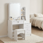 Modern Dressing Vanity Table – SEO Optimized Website Product Description Modern Dressing Vanity Table Enhance your bedroom with the Modern Dressing Vanity Table, a stylish and functional furniture piece designed to make your daily beauty routine more comfortable and organized. Whether you are getting ready for work, school, or a special occasion, this elegant vanity table provides a dedicated space for applying makeup, styling your hair, and storing your beauty essentials. Moreover, its contemporary design adds a touch of sophistication to bedrooms, apartments, hotels, and dressing rooms. Key Features Modern and elegant vanity table design Premium engineered wood construction Large mirror for convenient grooming and makeup application Spacious tabletop for cosmetics and beauty accessories Multiple storage drawers for organized storage Scratch-resistant laminated finish Strong and stable construction for long-lasting durability Smooth-gliding drawers with quality hardware Easy-to-clean and low-maintenance surface Compact design suitable for bedrooms and apartments Comfortable legroom for convenient seating Ideal for homes, apartments, hotels, and dressing rooms